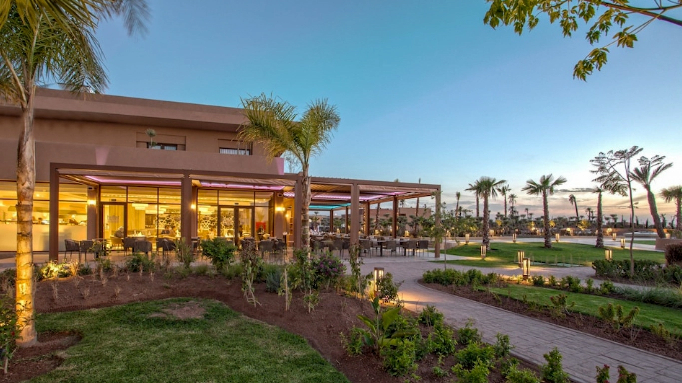 Be Live Collection Marrakech Adults Only All Inclusive hotel terrace dining and gardens at sunset
