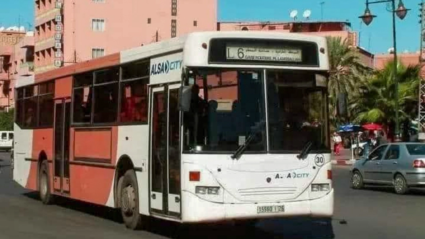Local ALSA city bus in Marrakech numbered 11 traveling through the city streets, offering an affordable public transport option for residents and visitors.
