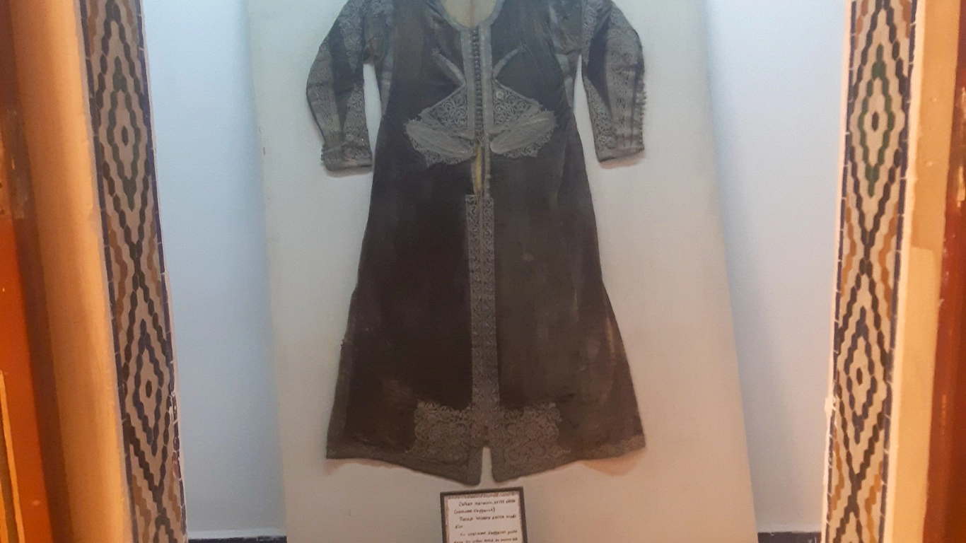 Traditional embroidered garment on display at the Marrakech Museum, highlighting Moroccan cultural heritage and historic craftsmanship.
