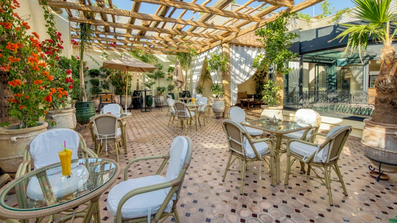 Luxury riads in Marrakech: Palais Tara & Spa featuring a beautiful terrace and relaxing outdoor seating.
