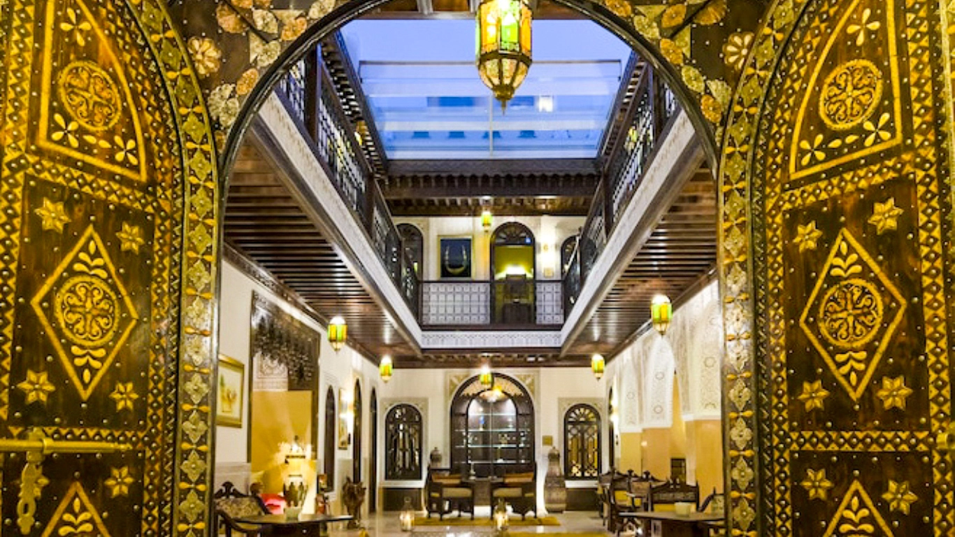 Luxury riads in Marrakech: Perlekech Riad & Spa with stunning archways and elegant interiors.
