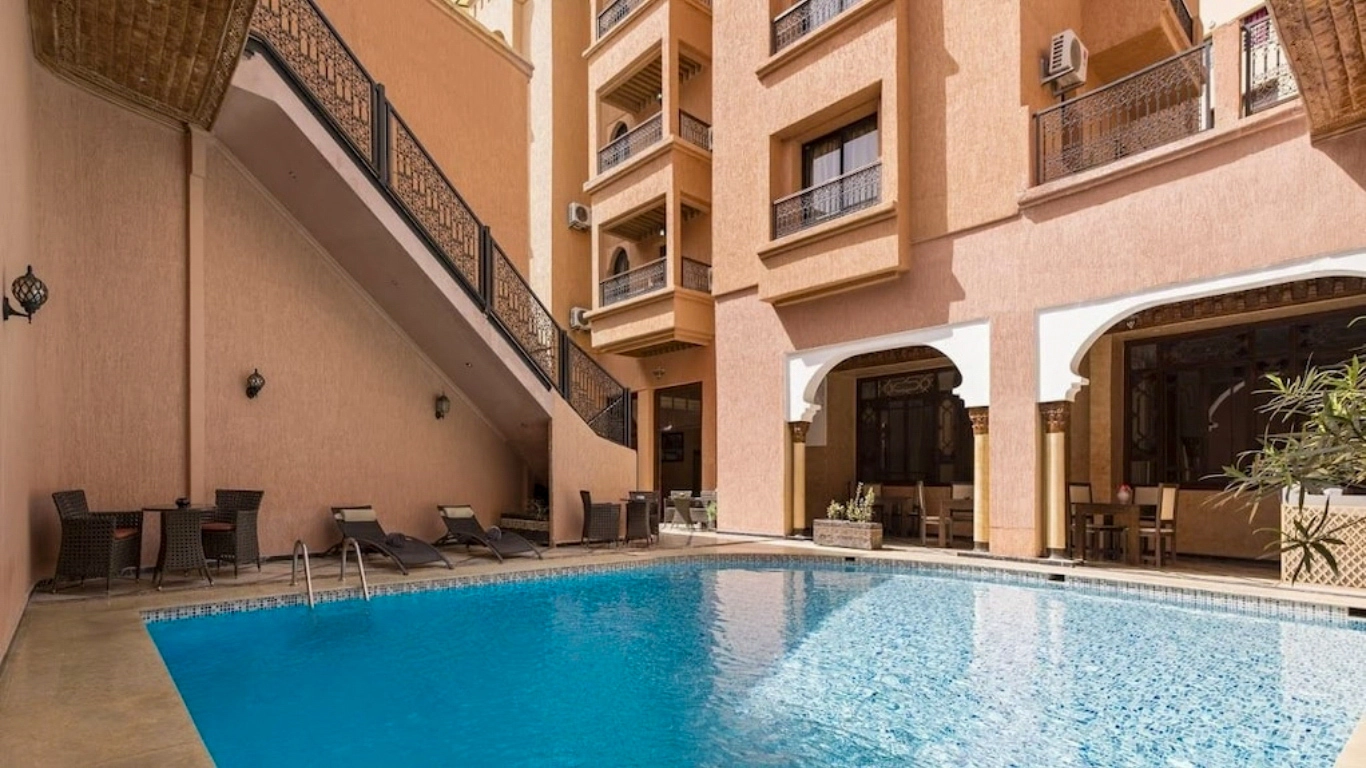 Outdoor pool and traditional architecture at Riad Marrakech House – budget-friendly riad in Marrakech