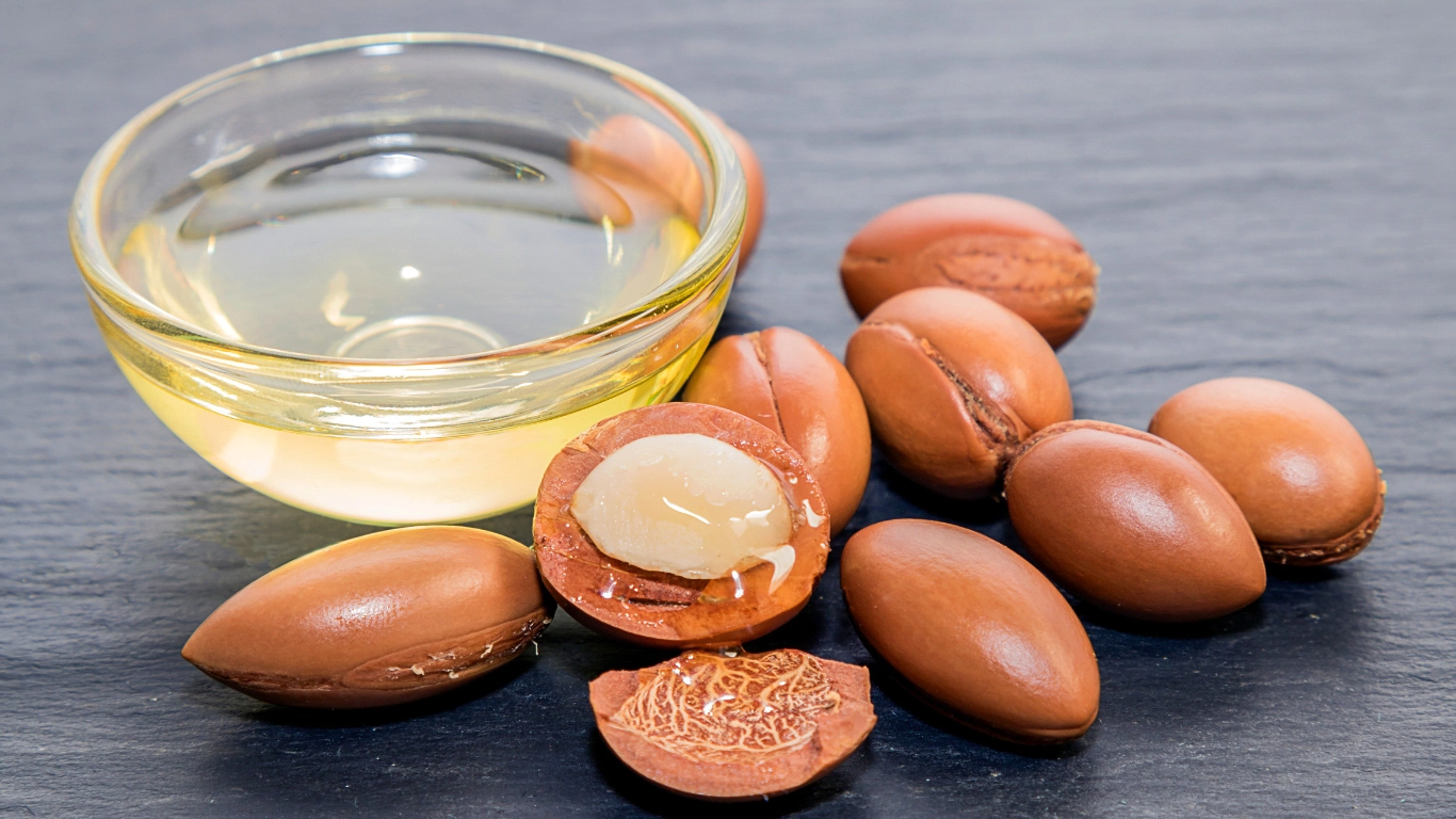 Authentic argan oil bottle from Marrakech with a traditional Moroccan background