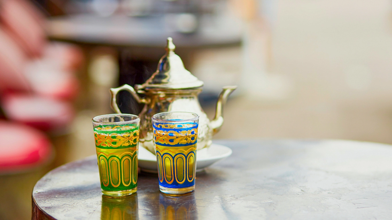 Traditional Moroccan green tea with mint served in a glass - what to buy in Marrakech